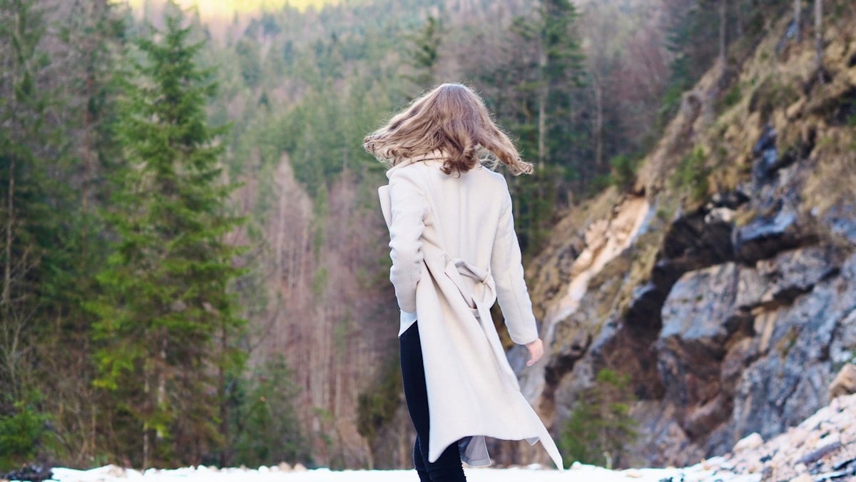 Woman in coat standing in forest 🌳 Nature Fashion Photography ✨